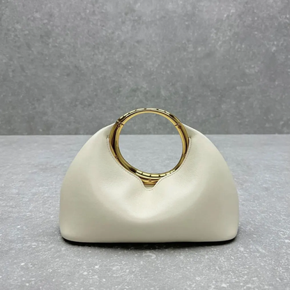 Soft Off-White Crescent Shaped Handheld Pouch With Polished Golden Circular Ring Grip, Central V-Cut Frame And Spacious Curved Open Inner Cavity