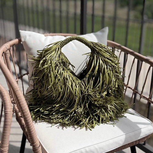 Muted Sage Green Full Fringe Covered Curved Hand Tote With Thick Braided Circular Grip Loop, Wide Open Spacious Inner Cavity And Flowing Layered Strand Detailing