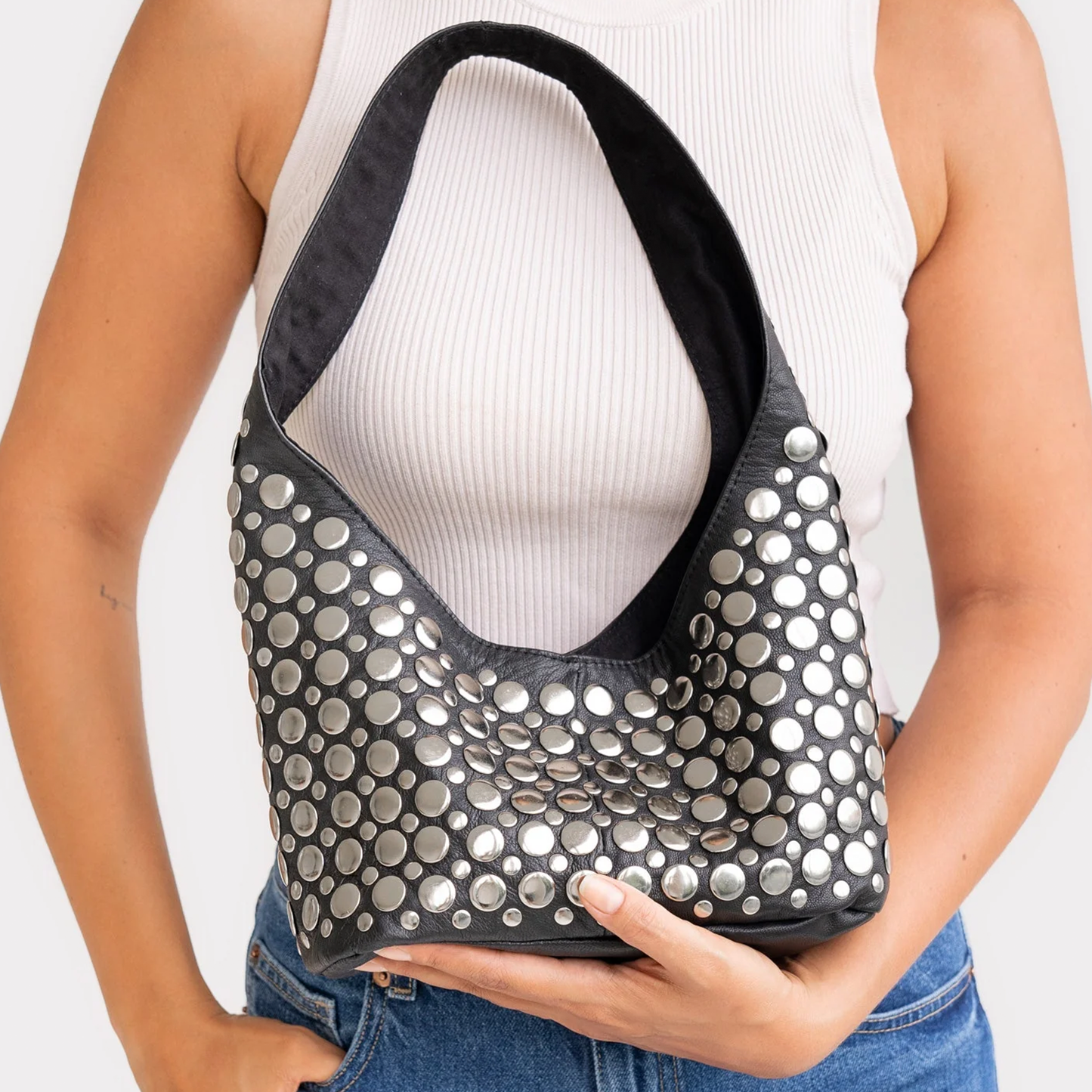 Jet Black Tapered Hobo Shoulder Bag With Scattered Multi-Size Silver Circular Disc Embellishments, Wide Integrated Single Shoulder Strap And Curved V-Shaped Top Opening