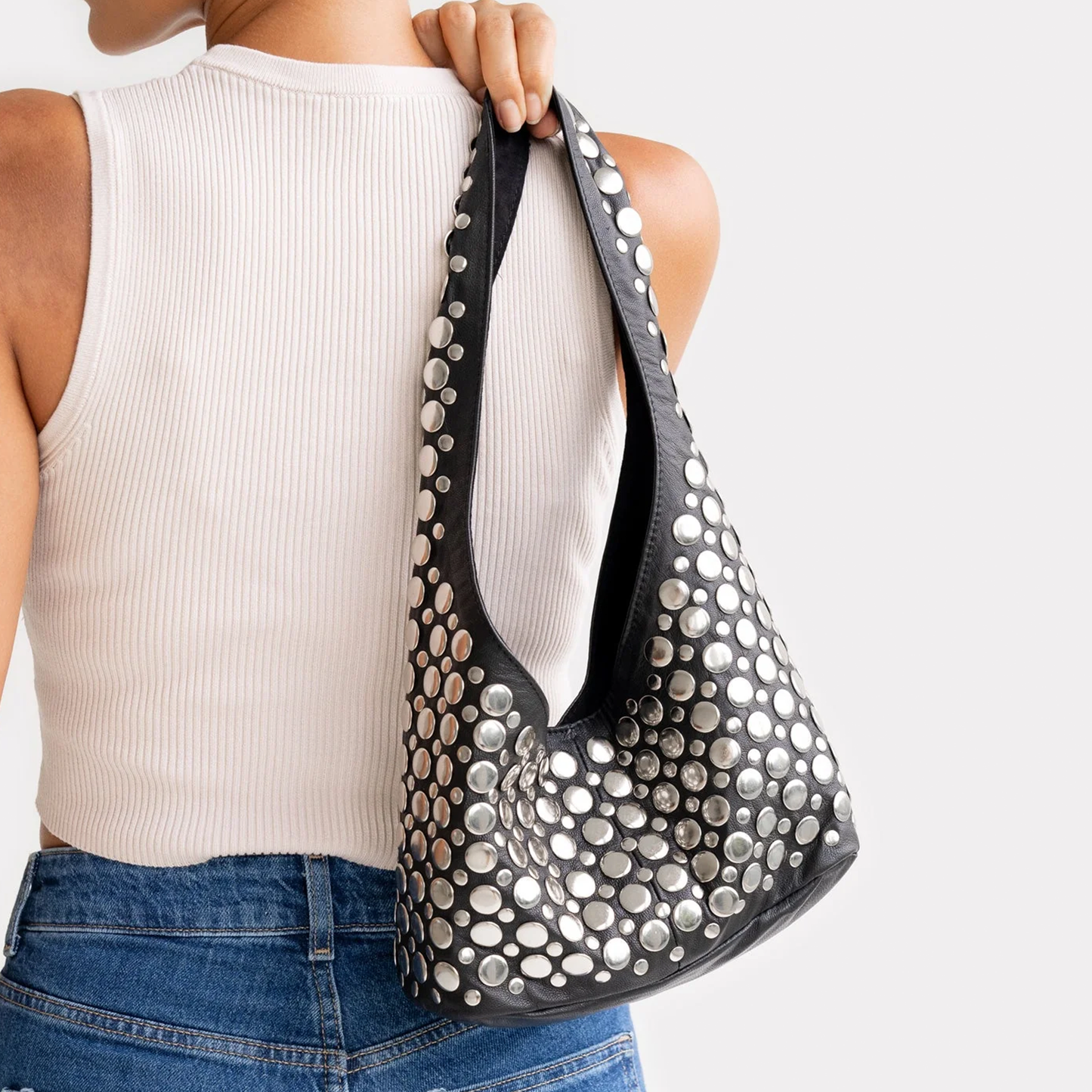 Jet Black Tapered Hobo Shoulder Bag With Scattered Multi-Size Silver Circular Disc Embellishments, Wide Integrated Single Shoulder Strap And Curved V-Shaped Top Opening