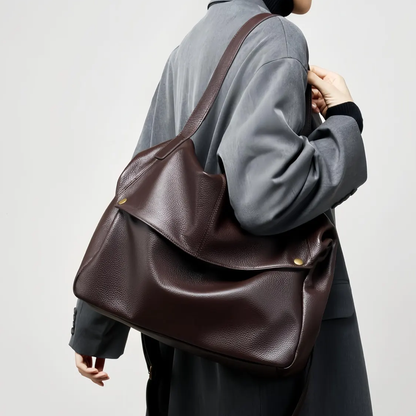 Deep Mocha Brown Soft Pillow Shaped Carryall With Golden Stud Fastened Overlap Flap, Wide Fixed Shoulder Strip And Spacious Slouchy Inner Compartment