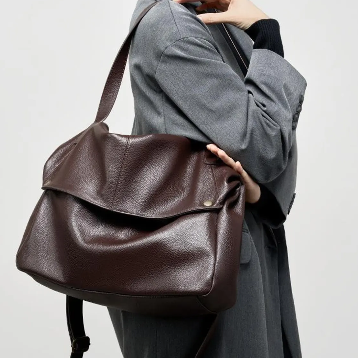 Deep Mocha Brown Soft Pillow Shaped Carryall With Golden Stud Fastened Overlap Flap, Wide Fixed Shoulder Strip And Spacious Slouchy Inner Compartment