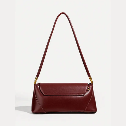Deep Wine Burgundy Elongated Rectangular Shoulder Bag With Glossy Smooth Surface, Golden Flap Clasp And Slim Single Shoulder Carry Strip