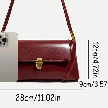Deep Wine Burgundy Elongated Rectangular Shoulder Bag With Glossy Smooth Surface, Golden Flap Clasp And Slim Single Shoulder Carry Strip