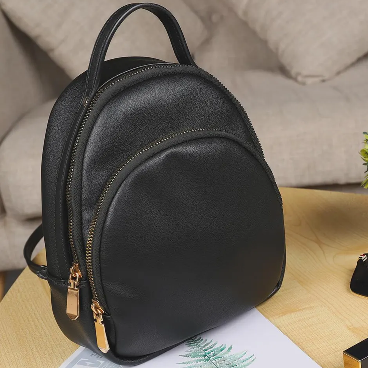 Solid Matte Black Curved Dome Mini Backpack With Dual Gold Tone Zipper Pulls, Short Curved Top Grip And Thin Metal Fitted Rear Support Straps