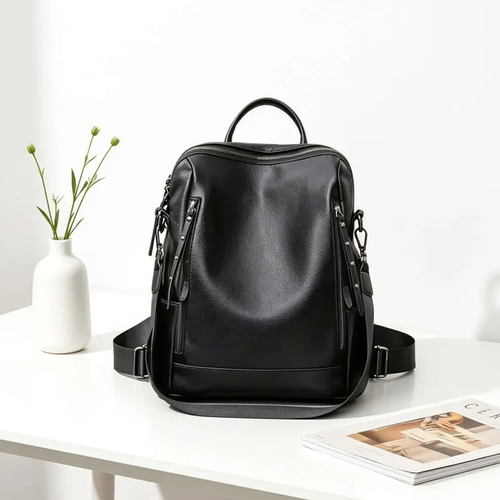 Polished Solid Black Vertical Structured Rucksack With Rivet Trimmed Side Zipper Slots, Rounded Top Carry Loop And Wide Weight Distributing Rear Bands